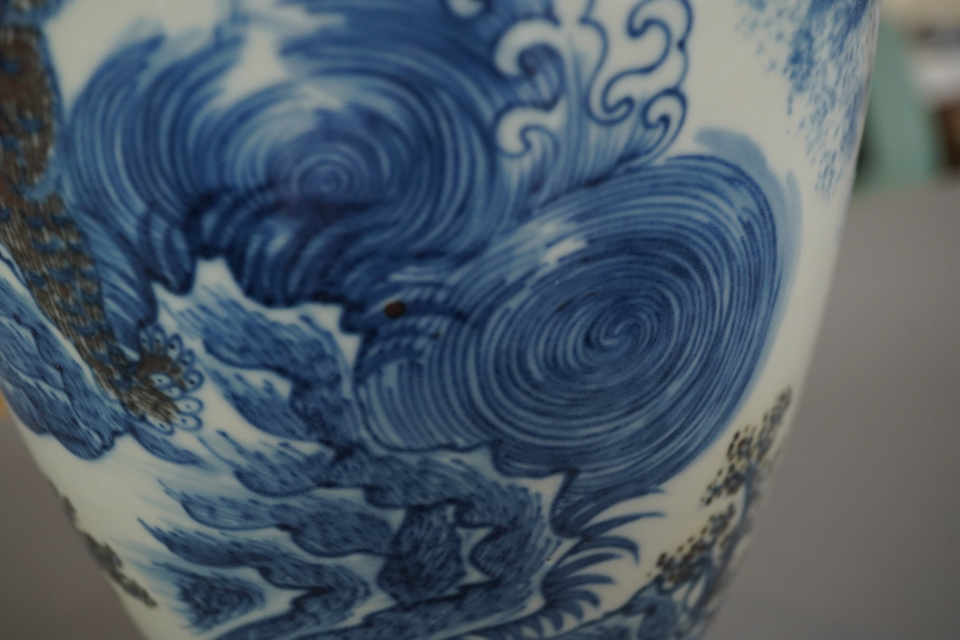 A Chinese underglaze blue and copper red ’dragon and tiger’ baluster vase, possibly 19th century